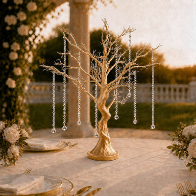 Gold decorative tree centerpiece with crystal bead strands at an outdoor wedding table
