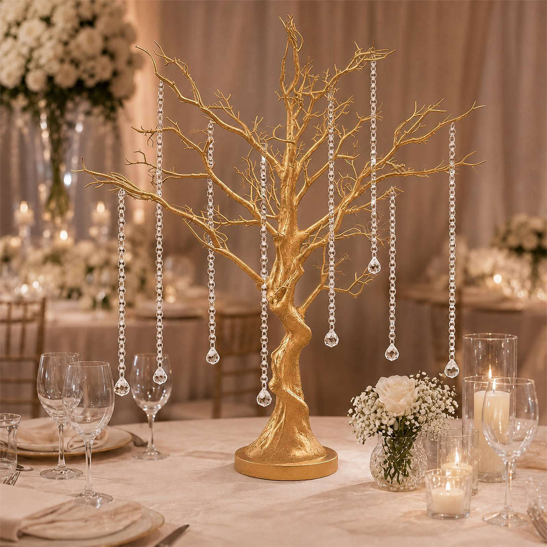 Gold tree centerpiece with crystal drops on elegant wedding table decor