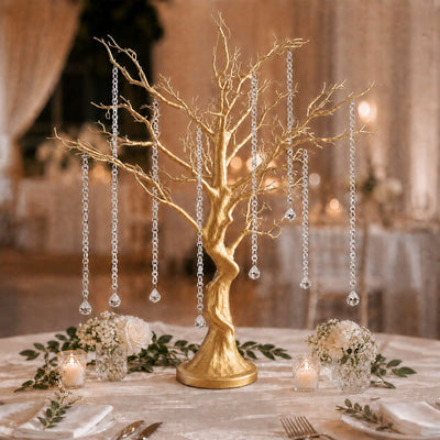 Gold tree centerpiece with hanging crystal beads at elegant wedding table