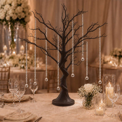 Elegant black tree centerpiece with crystal garlands for wedding table decor