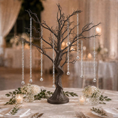 Elegant wedding table centerpiece with crystal hanging tree and candles