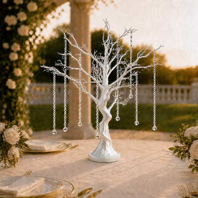 White decorative tree centerpiece with crystal drops at an elegant wedding table