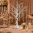 White crystal tree centerpiece with hanging gems at elegant wedding table