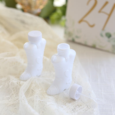 White boot-shaped bottles for party favors or decorations