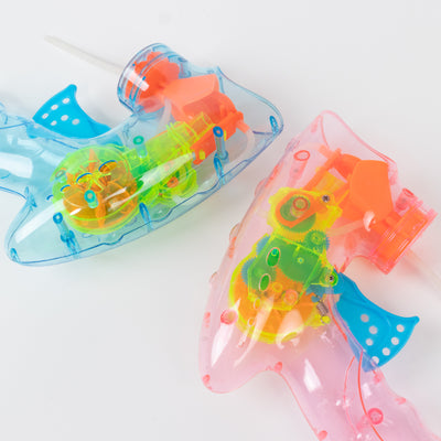 Colorful toy fish water guns in blue and pink, showcasing inner mechanics.