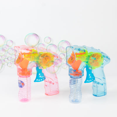 Bubble gun toys in pink and blue on a white background