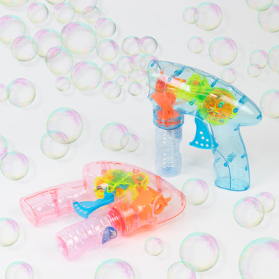Colorful bubble guns with bubbles in the air.