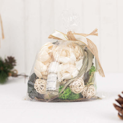 Decorative scented sachet with natural elements in clear packaging