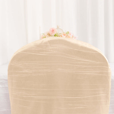 Elegant beige chair cover with subtle texture against a soft background.