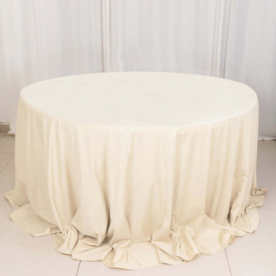 Cream oval tablecloth with elegant draping folds
