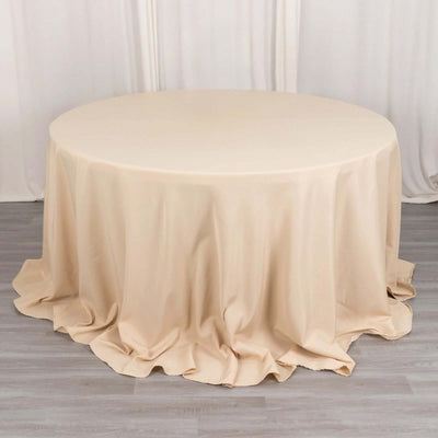 Beige round tablecloth draped elegantly over a circular table.