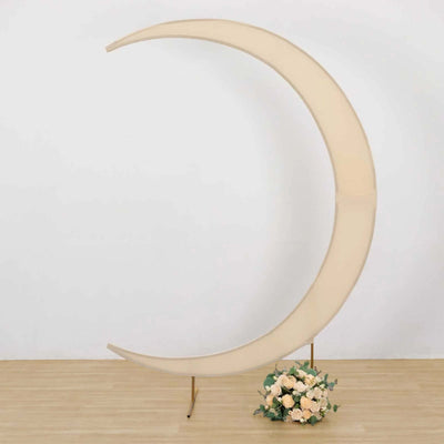 Cream crescent moon backdrop with floral arrangement at base