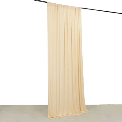 Cream fabric curtain hanging on a rod against a white background.