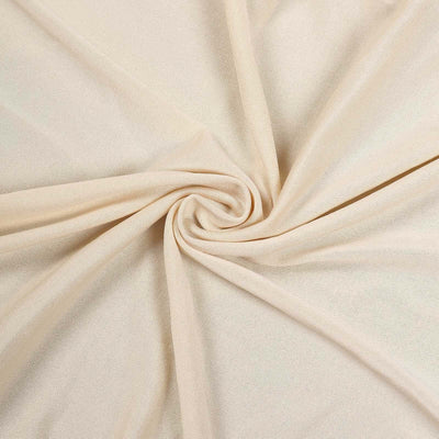 Light beige fabric with a soft texture, elegantly twisted in a circular pattern.