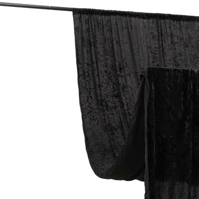 Black velvet backdrop draped on a support rod for photography.