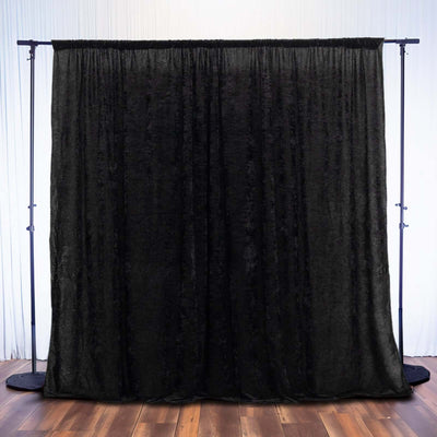 Black velvet backdrop for photography or events.