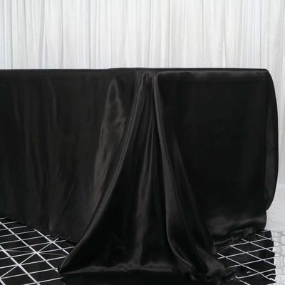 Black satin tablecloth draped elegantly over a table.