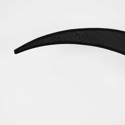 Black curved design element on a plain background.