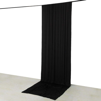 Black fabric backdrop hanging vertically for photography
