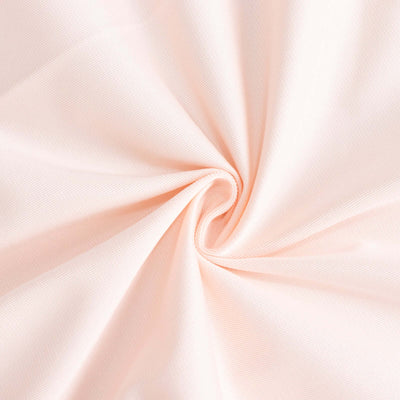 Light pink fabric texture with a soft, smooth finish.