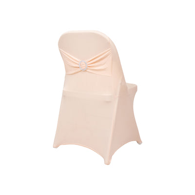 Peach chair cover with decorative bow and ring detail