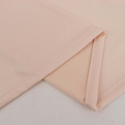 Peach fabric close-up showing smooth texture and clean seams.