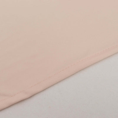 Close-up of soft pink fabric showing stitching detail.