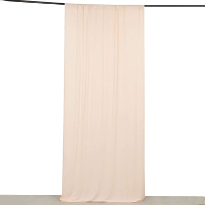 Peach fabric backdrop draped elegantly for photography.