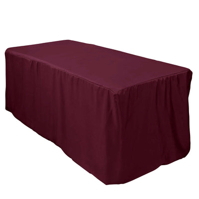 Maroon tablecloth draped over a rectangular table