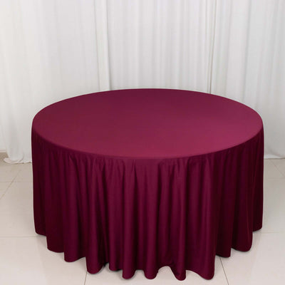 Burgundy round tablecloth draped elegantly over a circular table