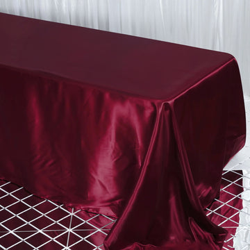 Elevate Your Event with the Burgundy Satin Seamless Rectangular Tablecloth
