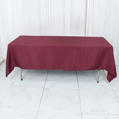 Maroon tablecloth on a rectangular table