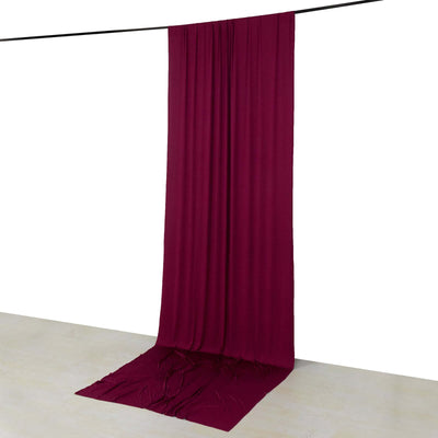 Burgundy fabric backdrop hanging from a rod for photography or events