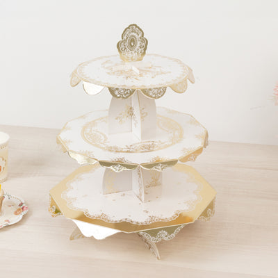 Elegant three-tiered cake stand with gold accents and floral design.