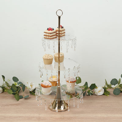 Elegant three-tiered dessert stand with crystal accents and assorted treats.