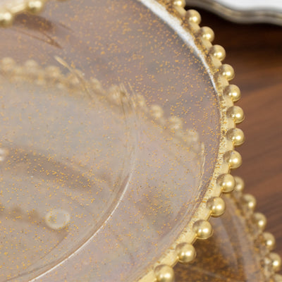 Gold beaded clear glass plate with glitter detail.