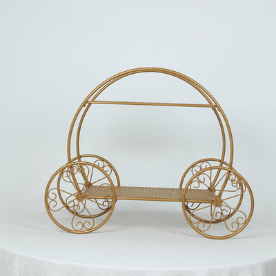 Gold decorative cart with intricate wheel design on white background