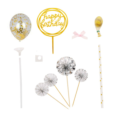 Birthday party decorations including balloons, cake toppers, and straws