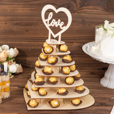 Chocolate candy tower with heart "love" topper for weddings and celebrations.