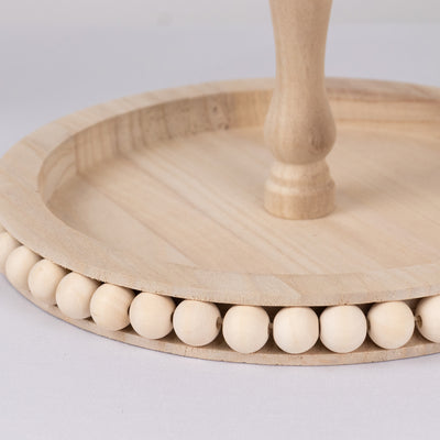 Natural wooden cake stand with decorative bead trim
