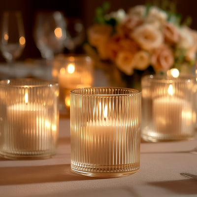 Elegant ribbed glass candle with warm glow, perfect for ambiance.