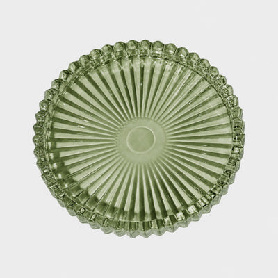 Green ribbed glass serving plate with scalloped edge, top view