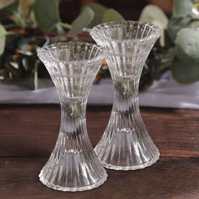 Elegant glass vases with a fluted design, perfect for floral arrangements.