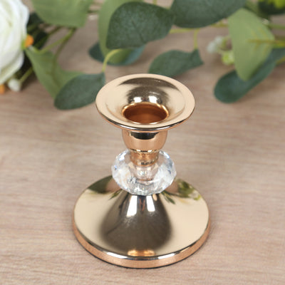 Elegant gold candlestick holder with crystal accent.