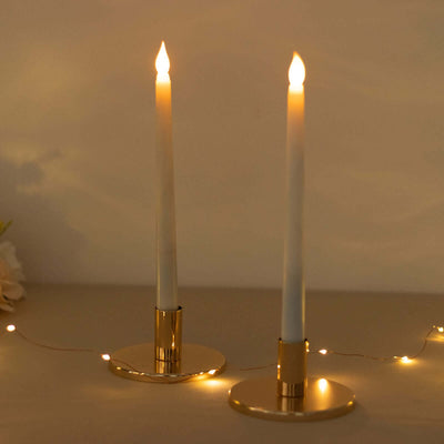 Elegant candle holders with white candles and warm lights.