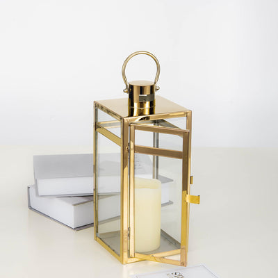 Gold lantern with a candle, elegantly displayed on stacked books.