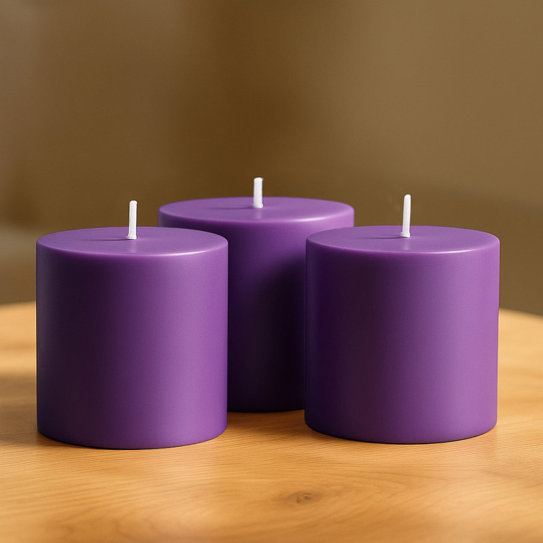 Purple cylindrical candles arranged on a wooden surface.