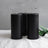Black pillar candles grouped with greenery