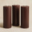 Brown pillar candles in three sizes