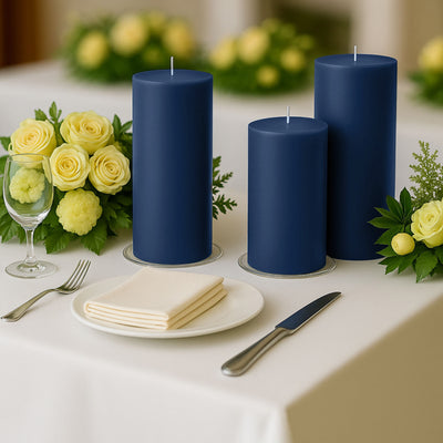 Three navy blue candles on a dining table with yellow flowers and tableware.